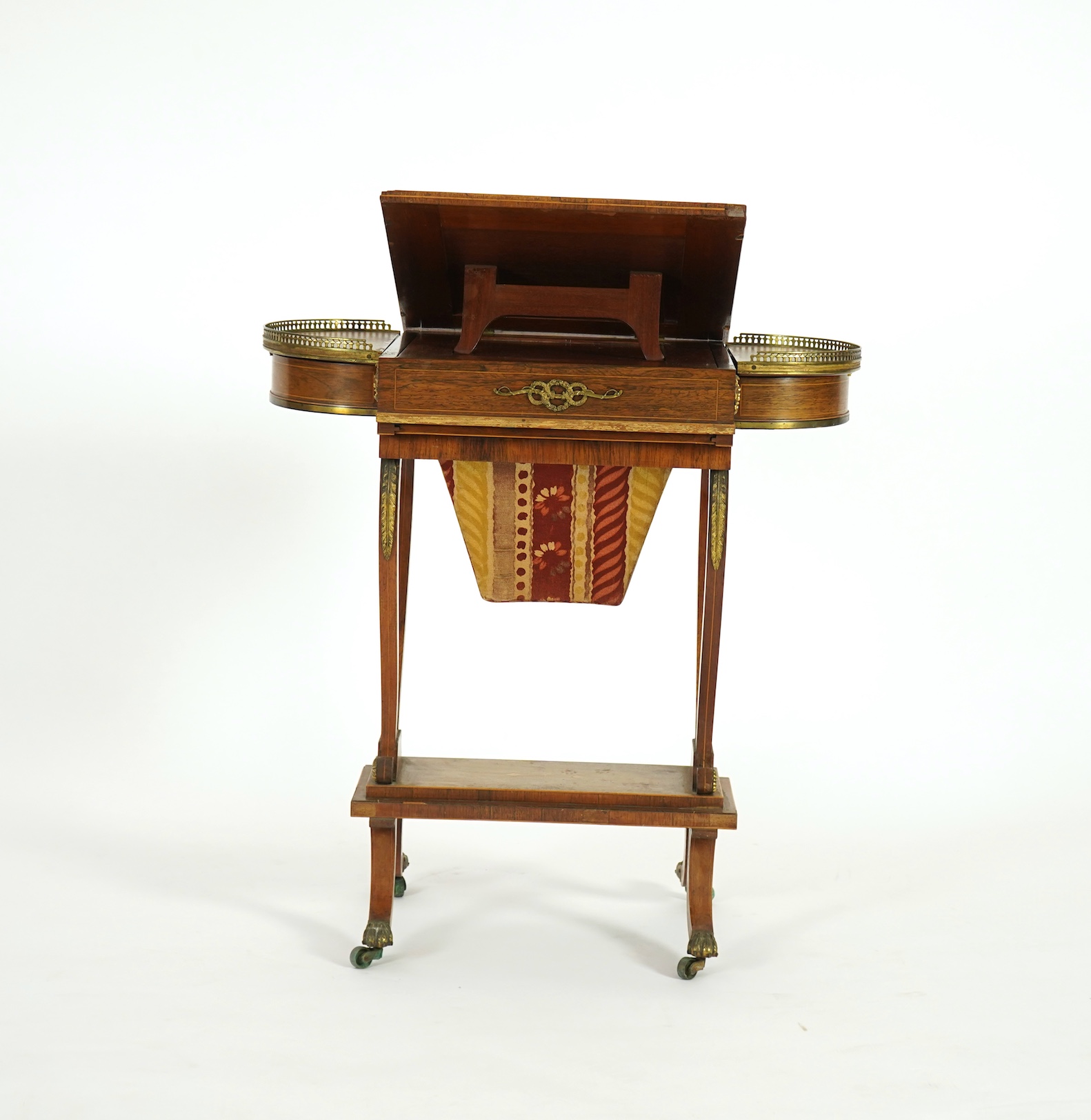 A Regency brass mounted rosewood writing, games and work table